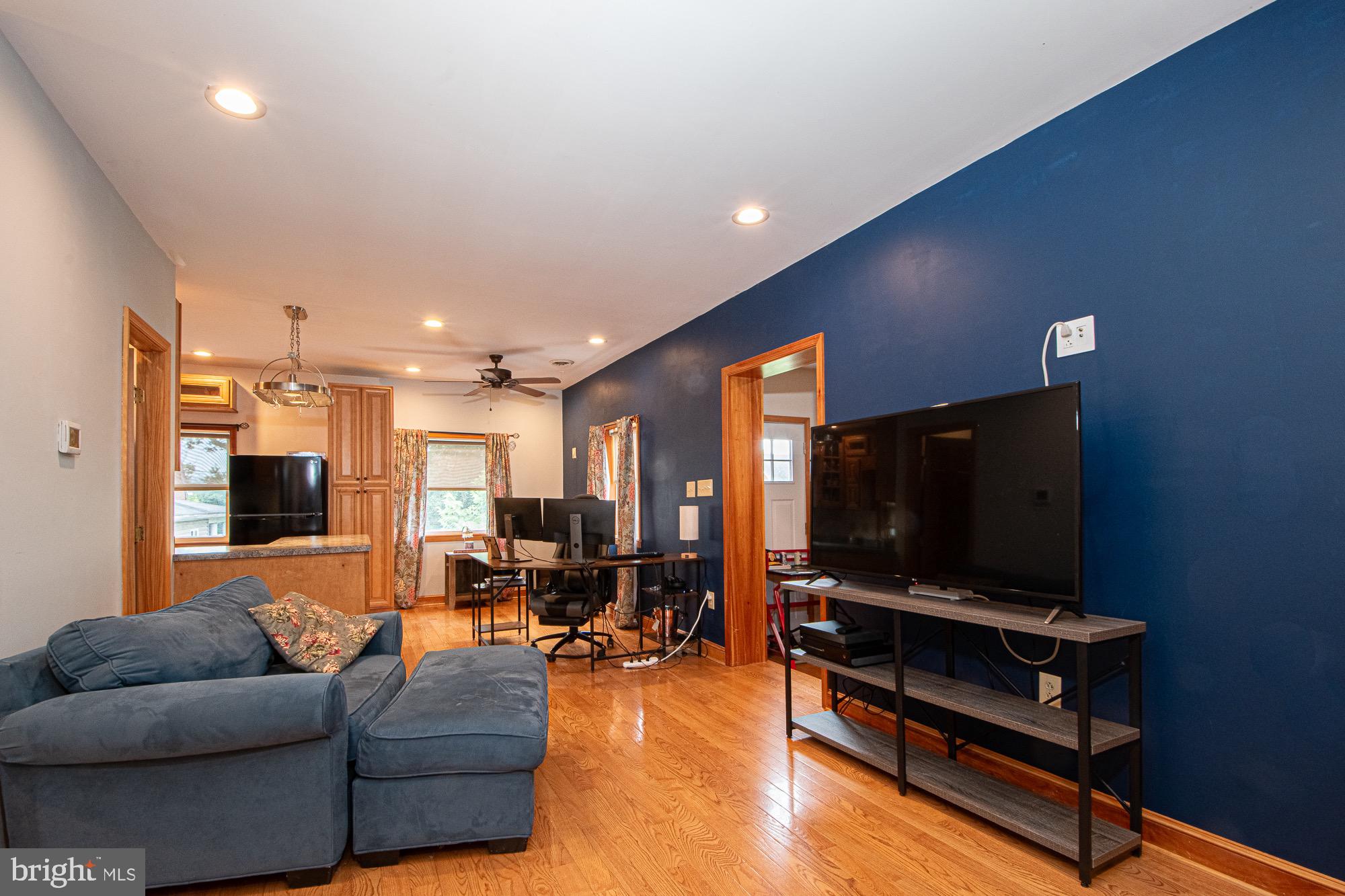 2180 Strasburg Road Front Royal, VA 22630 - Photo 27 of 90 a living room with furniture and a flat screen tv
