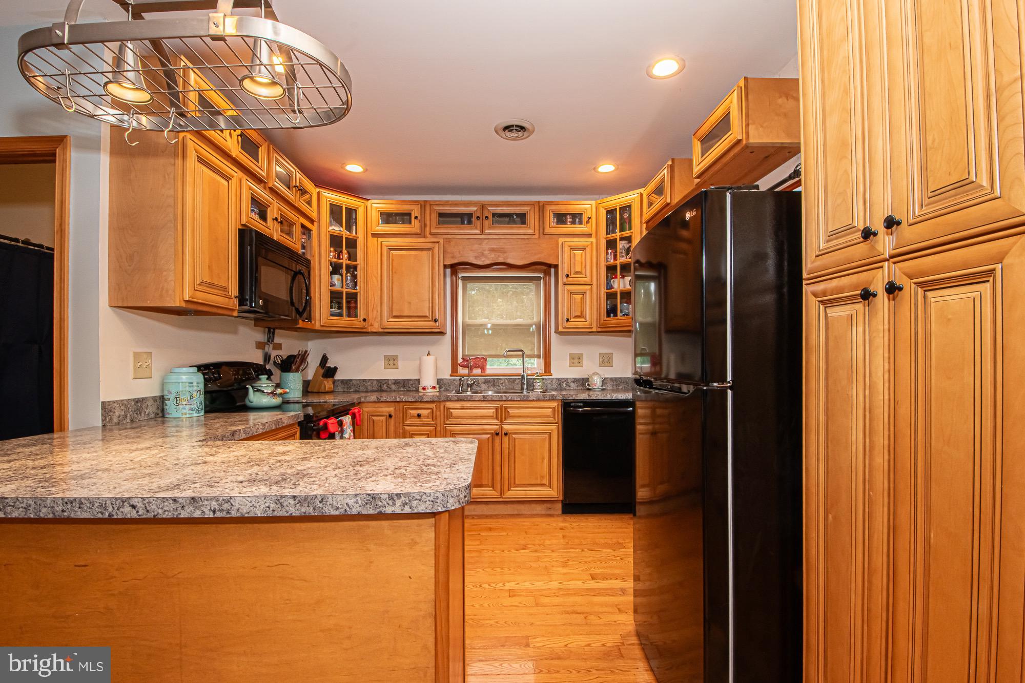 2180 Strasburg Road Front Royal, VA 22630 - Photo 31 of 90 a kitchen with stainless steel appliances granite countertop a refrigerator a stove top oven a sink and dishwasher