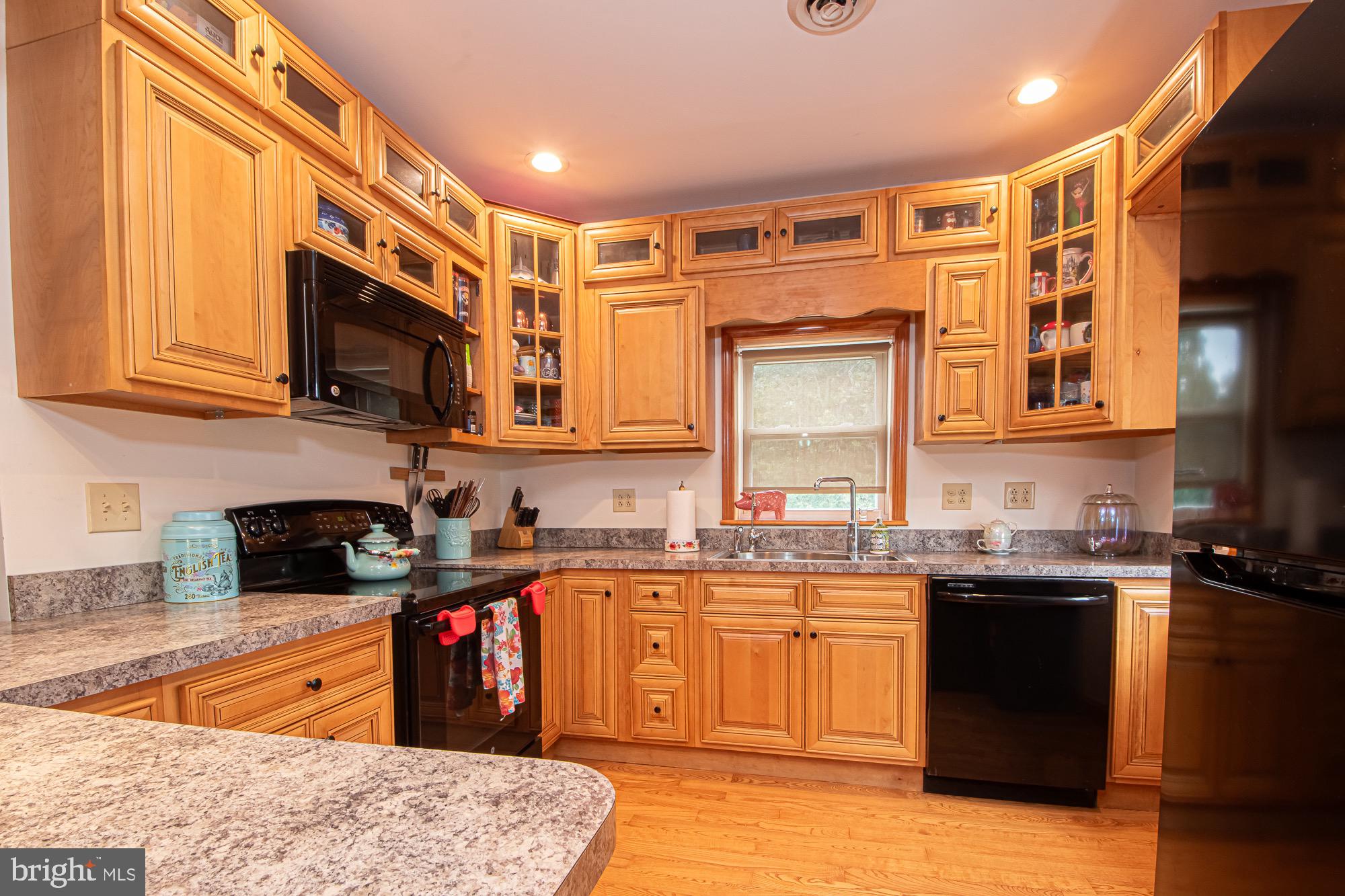 2180 Strasburg Road Front Royal, VA 22630 - Photo 32 of 90 a kitchen with stainless steel appliances granite countertop wooden cabinets a sink and dishwasher