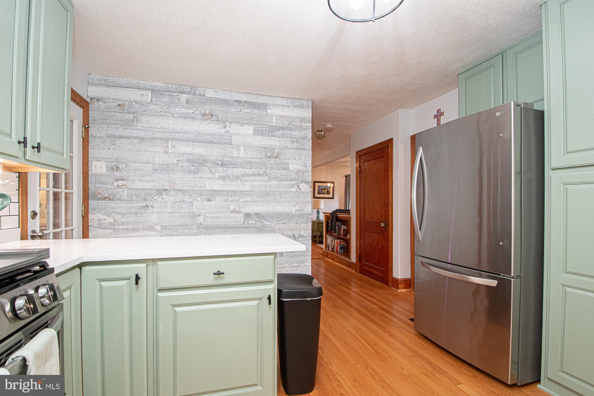 2180 Strasburg Road Front Royal, VA 22630 - Photo 52 of 90 a kitchen with stainless steel appliances a refrigerator and a stove top oven