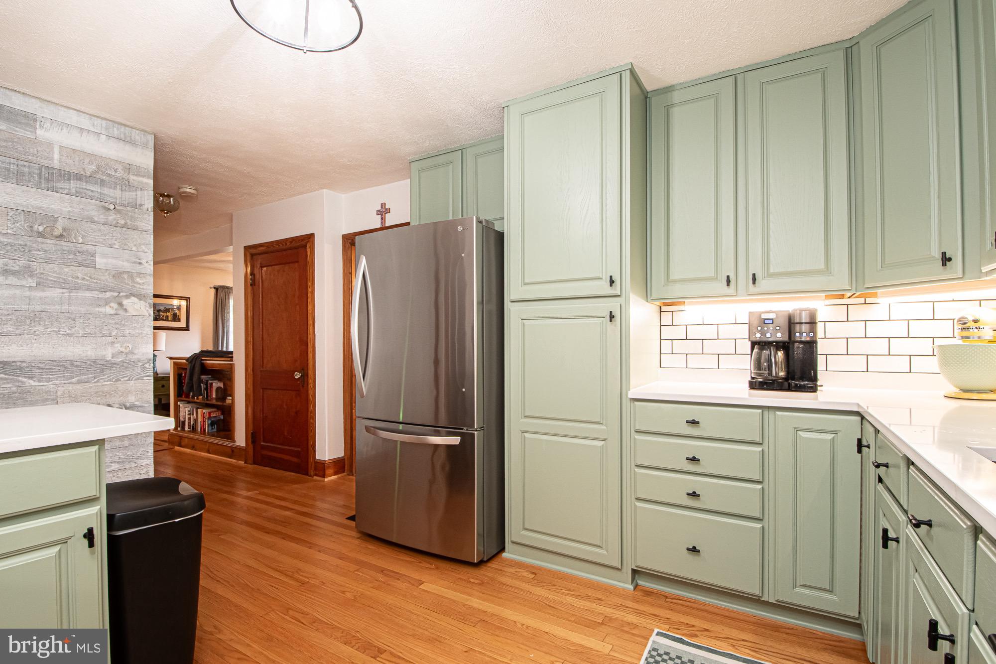 2180 Strasburg Road Front Royal, VA 22630 - Photo 53 of 90 a kitchen with granite countertop a refrigerator and a stove top oven