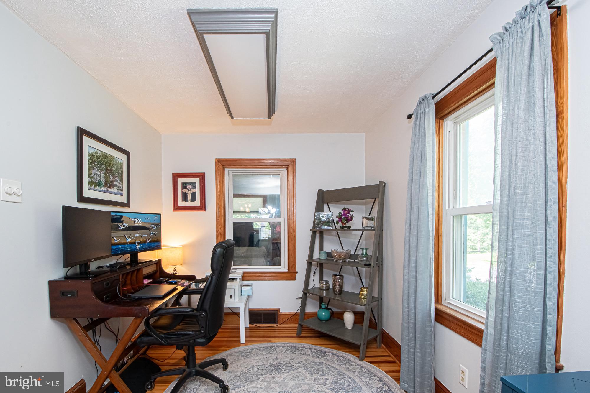 2180 Strasburg Road Front Royal, VA 22630 - Photo 59 of 90 a living room with furniture a rug and a window
