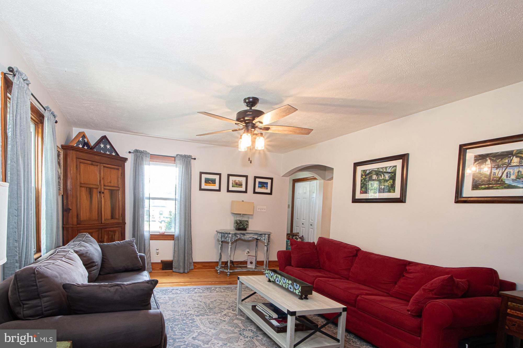 2180 Strasburg Road Front Royal, VA 22630 - Photo 60 of 90 a living room with furniture ceiling fan and a window