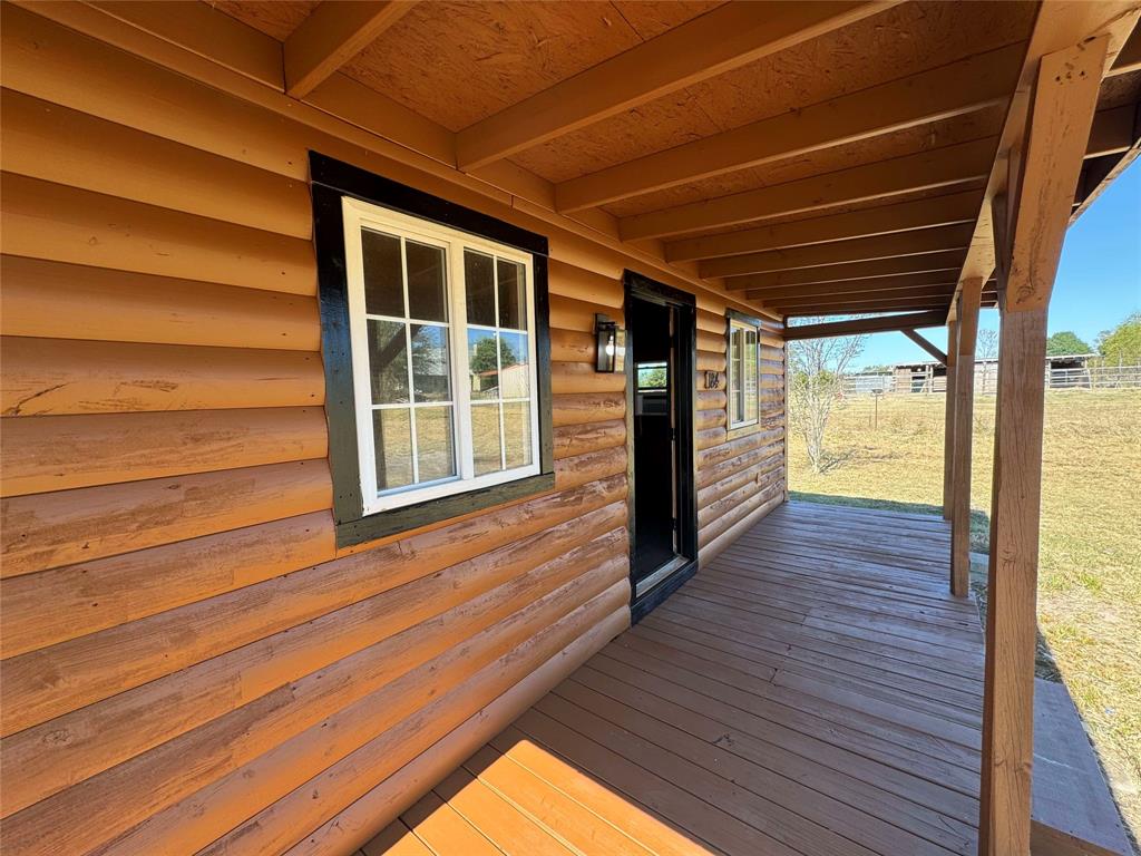 184 County Road Pattonville, TX 75468 - Photo 5 of 20 a view of empty room with wooden floor and fan