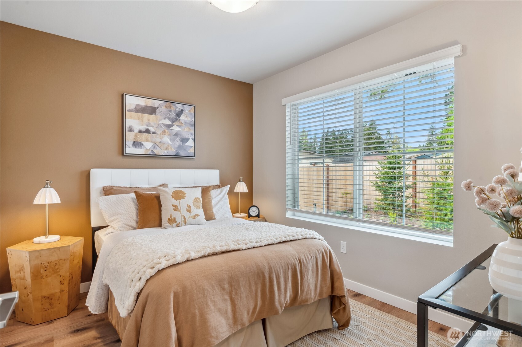 1322 194th Street Southeast, Unit D6 Bothell, WA 98012 - Photo 17 of 18 a bed sitting in a bedroom next to a window