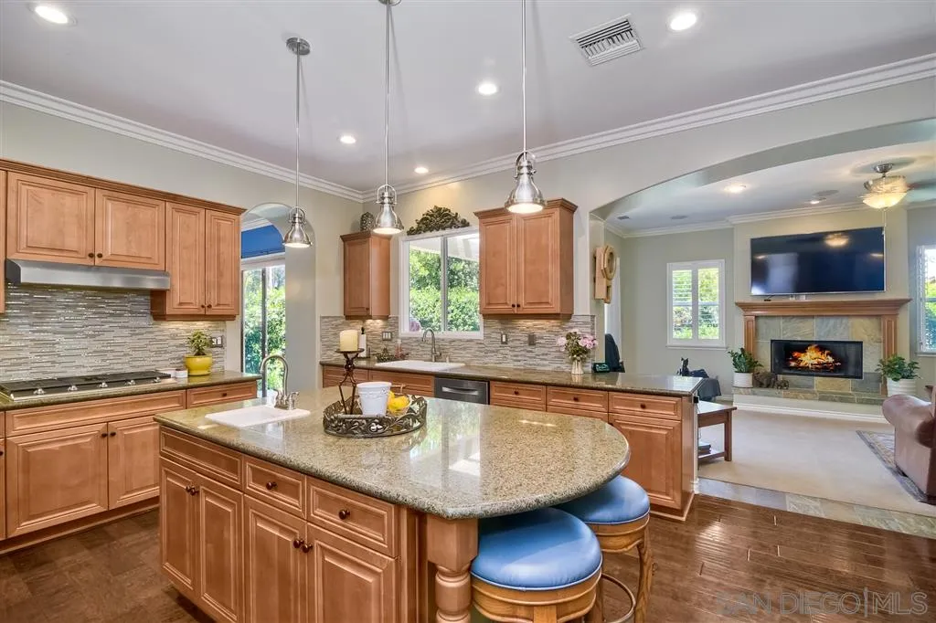 1728 Yucca Road Oceanside, CA 92054 - Photo 11 of 25 a kitchen with a sink stove and cabinets
