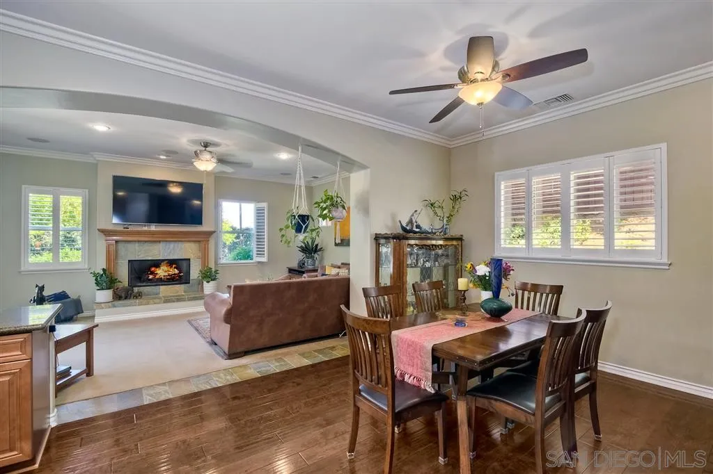 1728 Yucca Road Oceanside, CA 92054 - Photo 13 of 25 a view of a dining room with furniture window and wooden floor