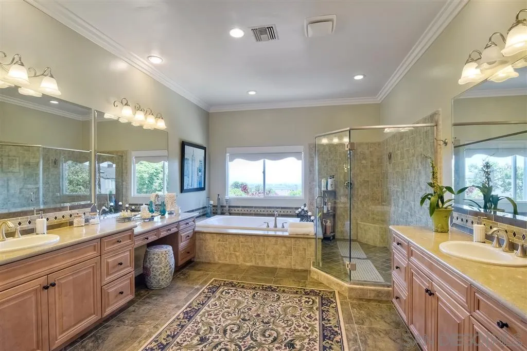 1728 Yucca Road Oceanside, CA 92054 - Photo 17 of 25 a bathroom with a large tub sink shower and mirror