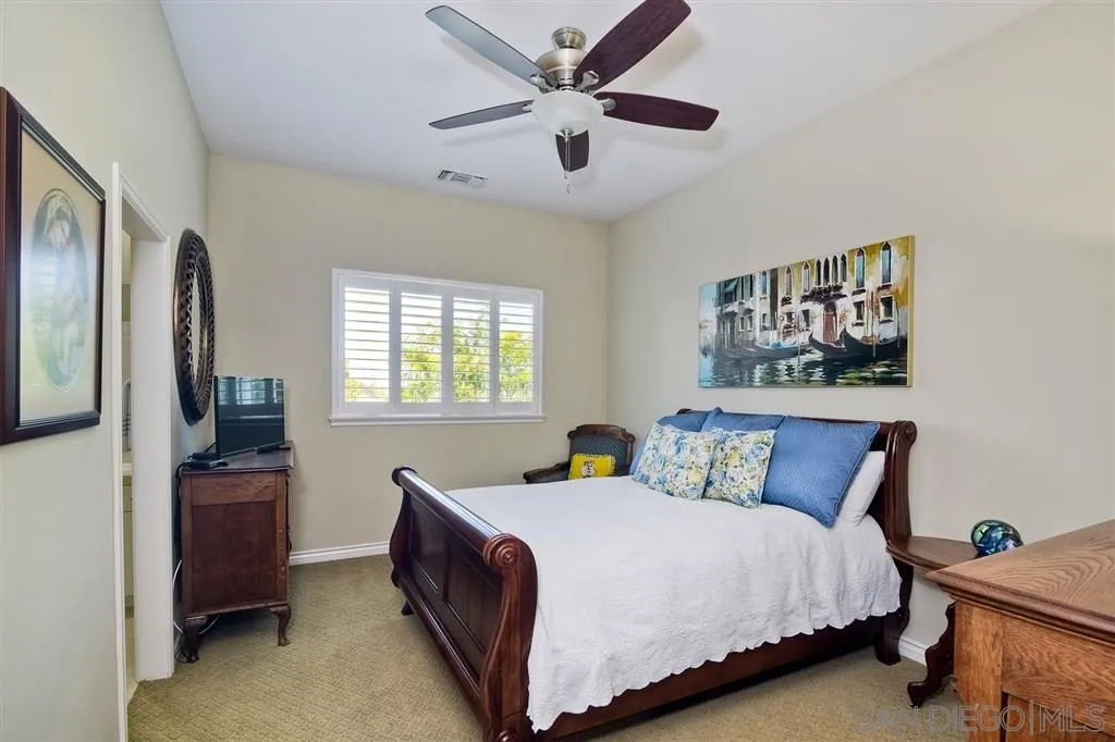 1728 Yucca Road Oceanside, CA 92054 - Photo 20 of 25 a bedroom with a bed and a dresser next to a window