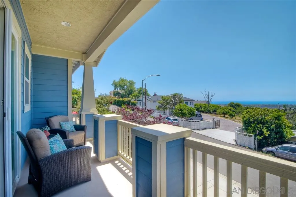 1728 Yucca Road Oceanside, CA 92054 - Photo 5 of 25 a view of a patio with couches table and chairs and potted plants
