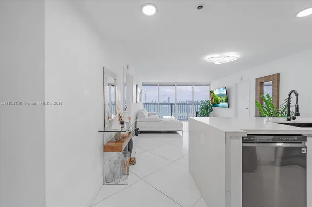 a kitchen with stainless steel appliances a white stove top oven and a refrigerator