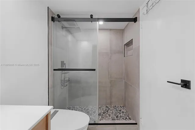 a bathroom with a shower and a toilet