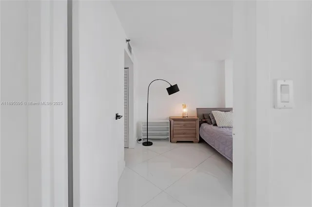 a bed room with furniture and a window