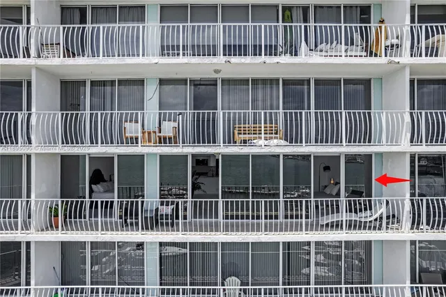 a view of a large building with a deck
