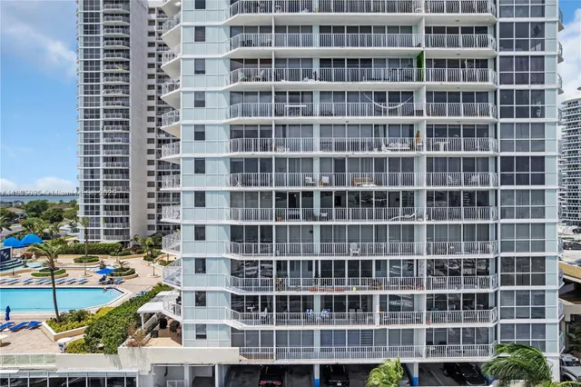 a front view of a building with a garden
