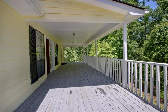 a view of outdoor space with wooden floor and deck