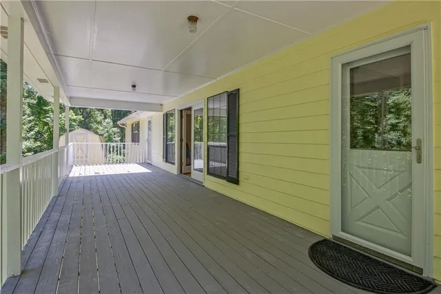 a view of outdoor space with wooden floor