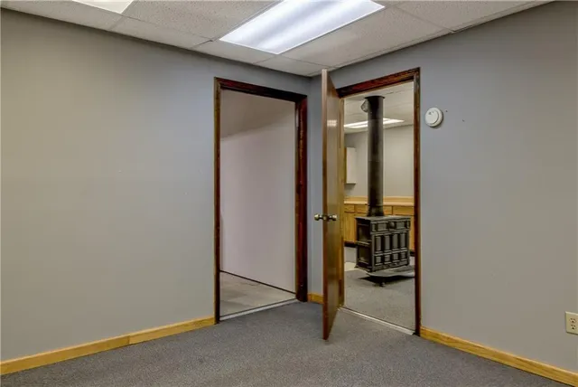 a living room with furniture stove and a refrigerator