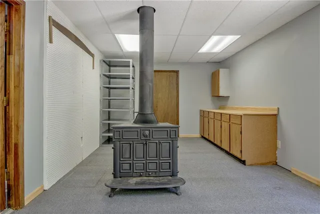 a view of an empty room with large windows