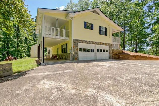 a view of a porch with wooden floor and fence