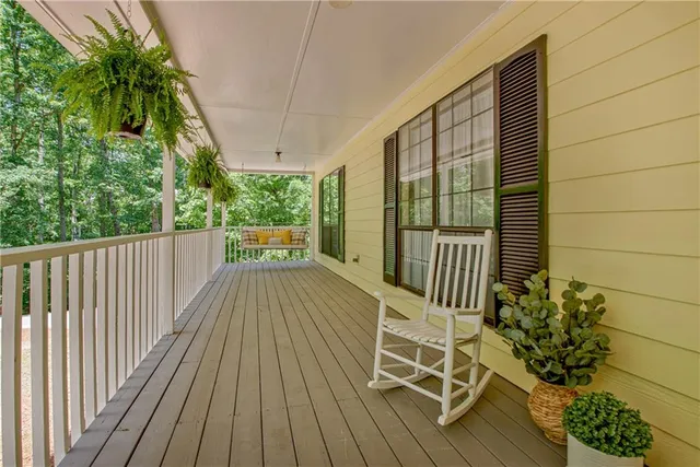 a balcony with wooden floor
