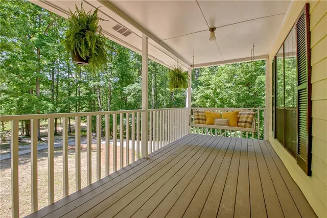 a view of porch with wooden floor