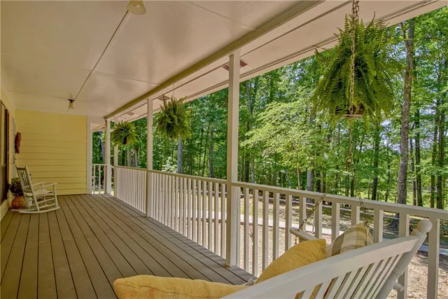 a view of balcony with furniture