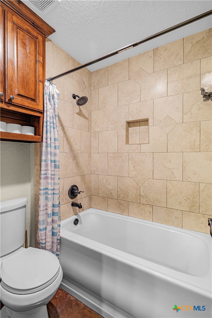 759 Richter Road Inez, TX 77968 - Photo 34 of 48 a bathroom with a toilet and a bath tub