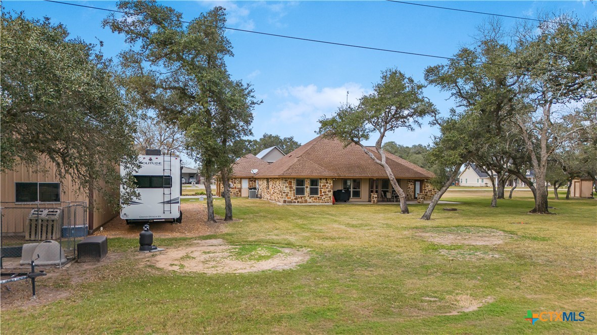 759 Richter Road Inez, TX 77968 - Photo 7 of 48 a yellow house in middle of a yard