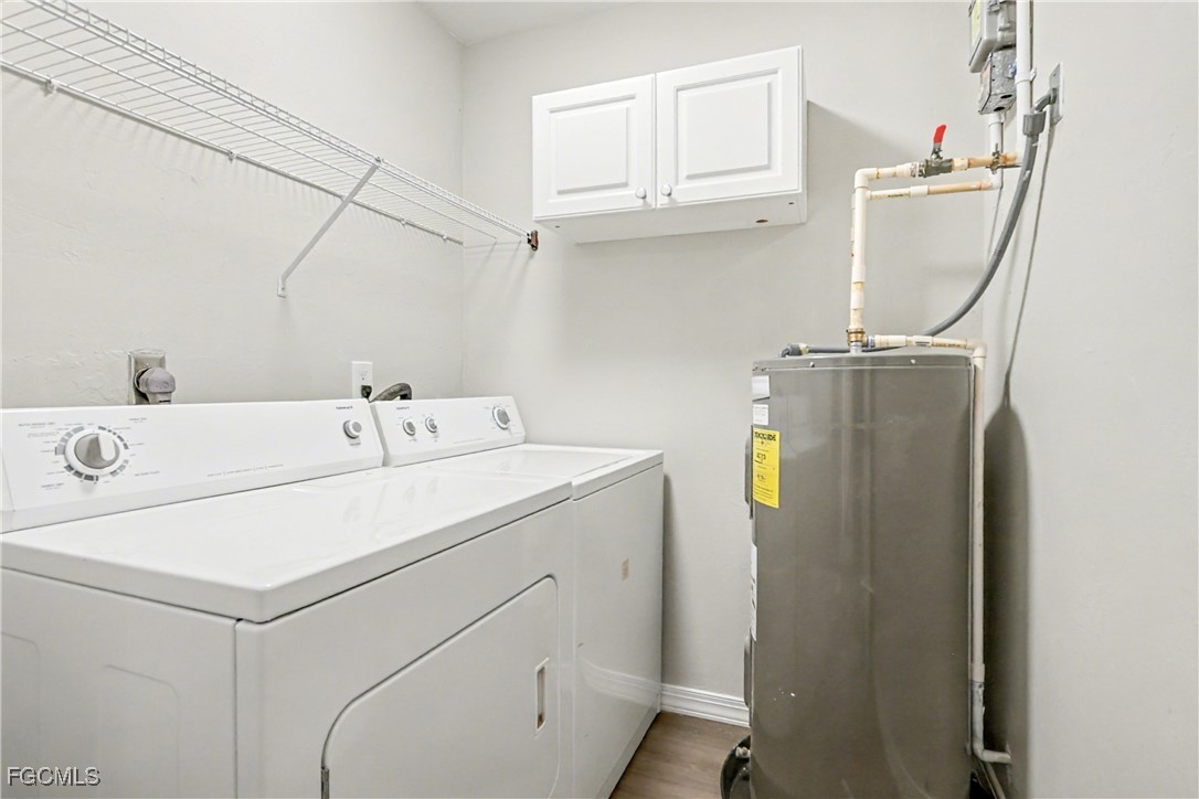 1416 Southwest 50th Street, Unit 63 Cape Coral, FL 33914 - Photo 22 of 23 a utility room with dryer and washer