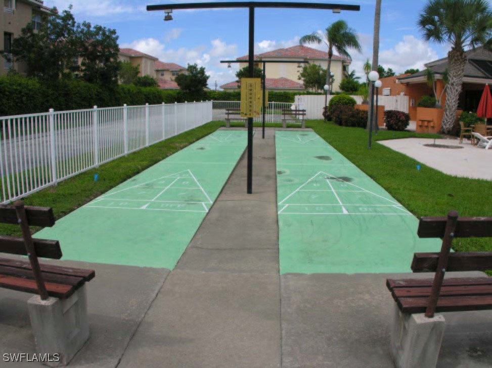 1416 Southwest 50th Street, Unit 63 Cape Coral, FL 33914 - Photo 10 of 23 a view of a backyard with sitting area