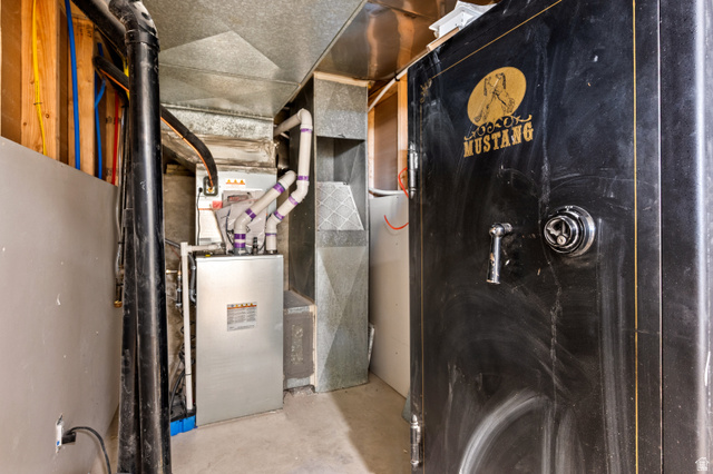 189 West Center Street Midvale, UT 84047 - Photo 36 of 64 HVAC system present, featuring visible ductwork and piping. Mid 20th-Century Mustang gun safe provides a significant deterrent and a reasonable level of protection for personal valuables