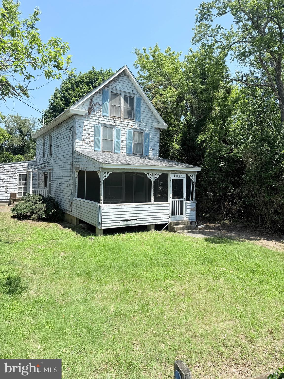 35617 Airport Road Rehoboth Beach, DE 19971 - Photo 4 of 4 a front view of a house with a yard
