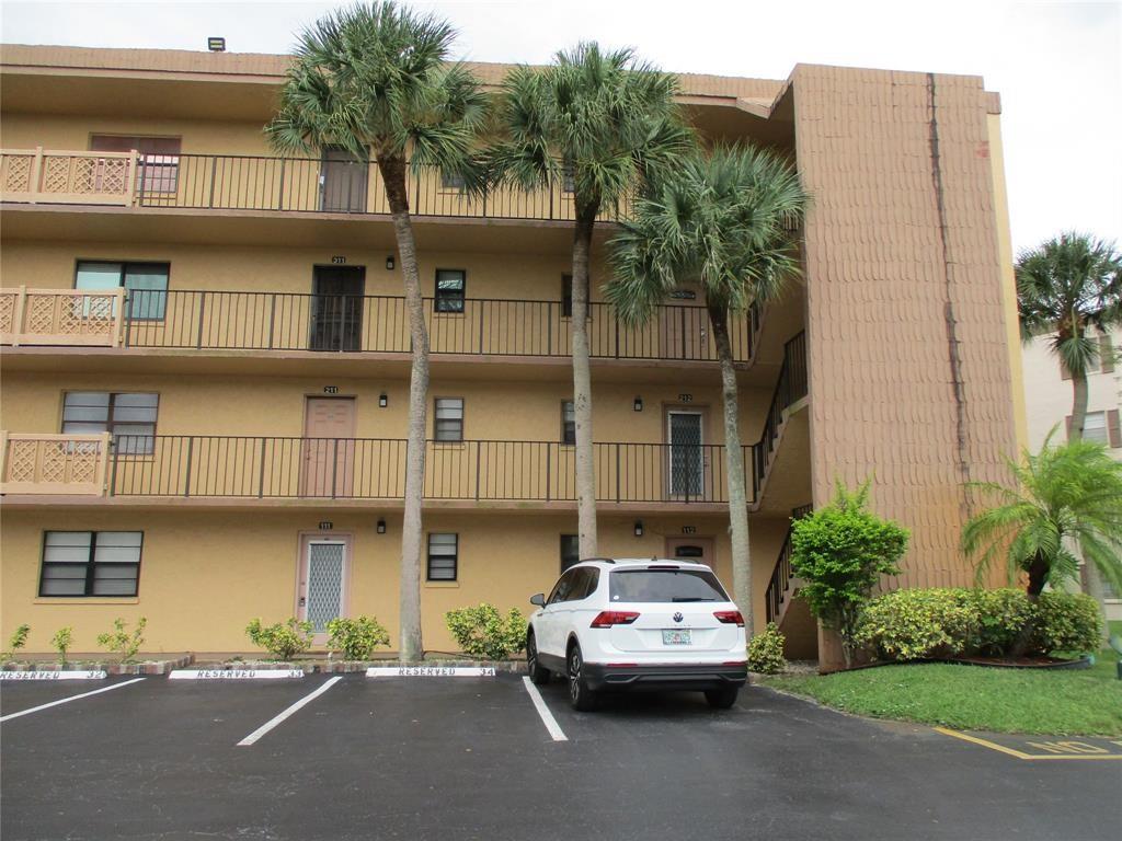 9370 Southwest 8th Street, Unit 312 312 Boca Raton, FL 33428 - Photo 1 of 41 a car parked in front of a building