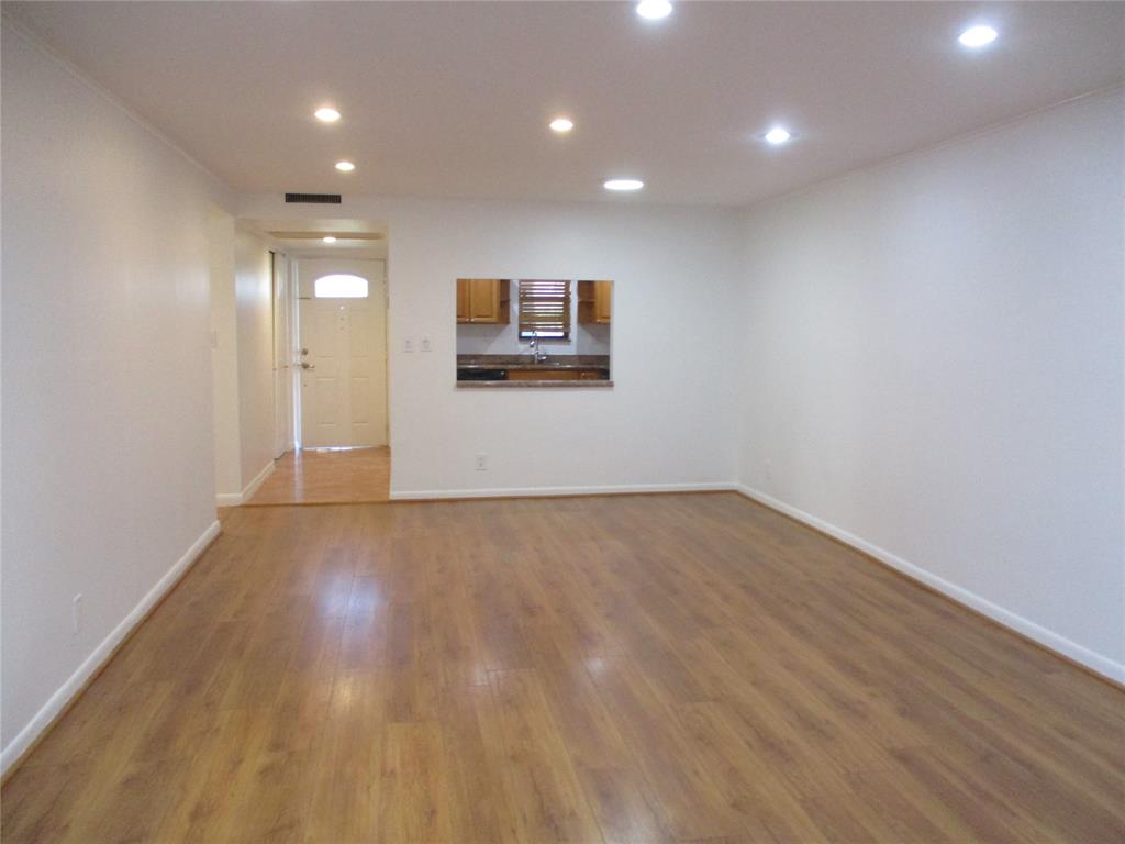 9370 Southwest 8th Street, Unit 312 312 Boca Raton, FL 33428 - Photo 18 of 41 an empty room with wooden floor and windows