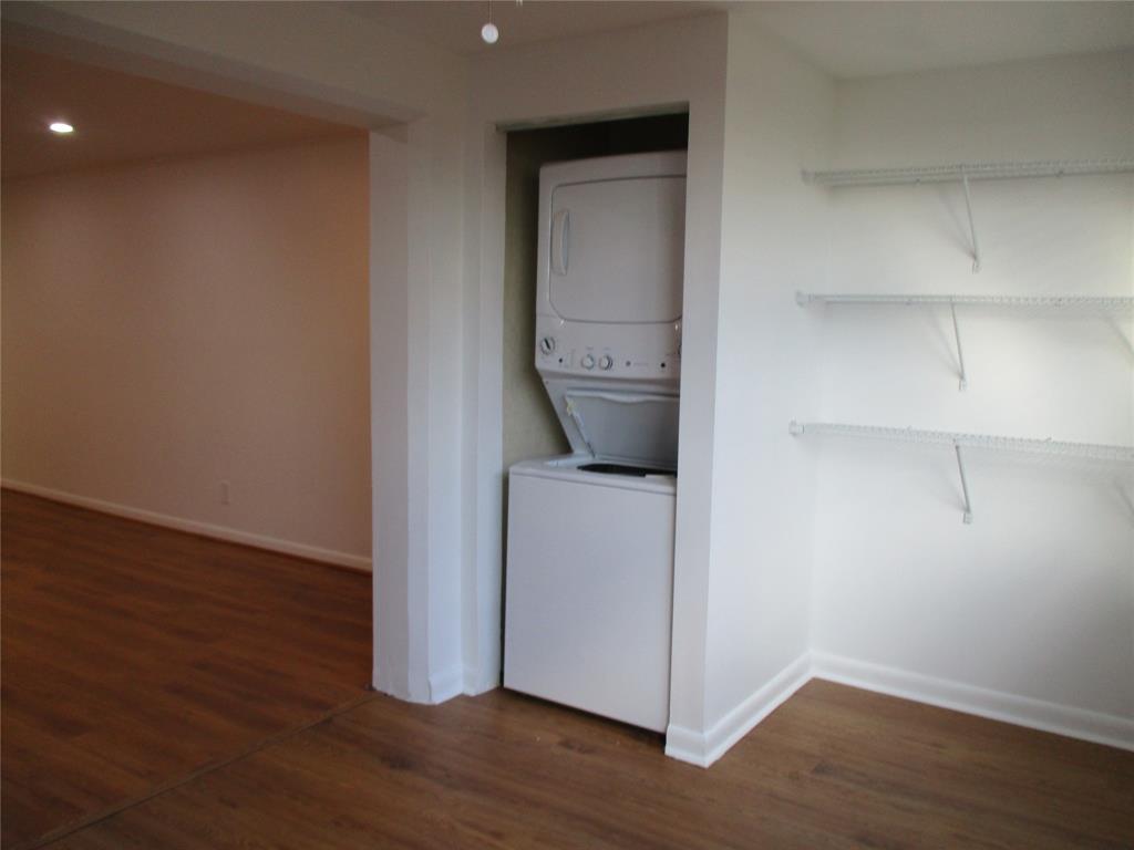 9370 Southwest 8th Street, Unit 312 312 Boca Raton, FL 33428 - Photo 21 of 41 a view of storage and utility room with wooden floor