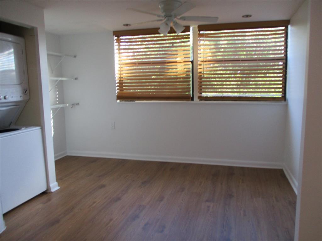 9370 Southwest 8th Street, Unit 312 312 Boca Raton, FL 33428 - Photo 22 of 41 a view of an empty room with wooden floor and a window
