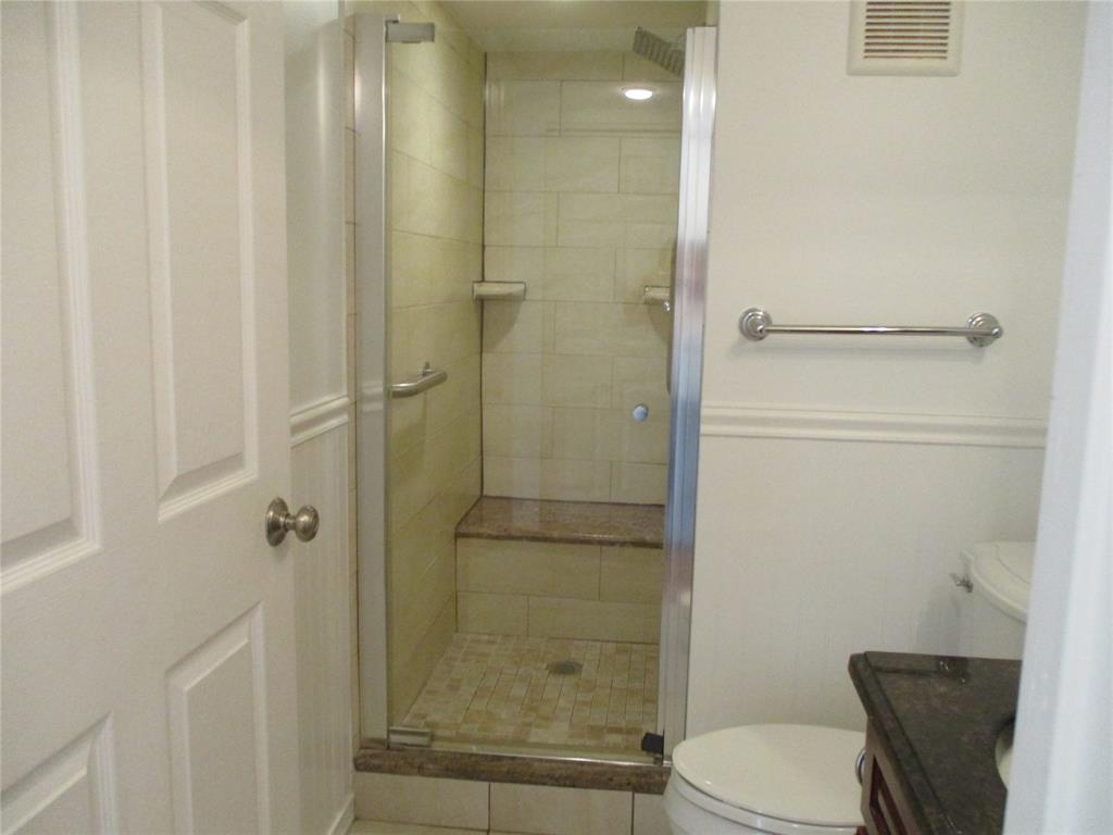 9370 Southwest 8th Street, Unit 312 312 Boca Raton, FL 33428 - Photo 24 of 41 a bathroom with a shower and a toilet