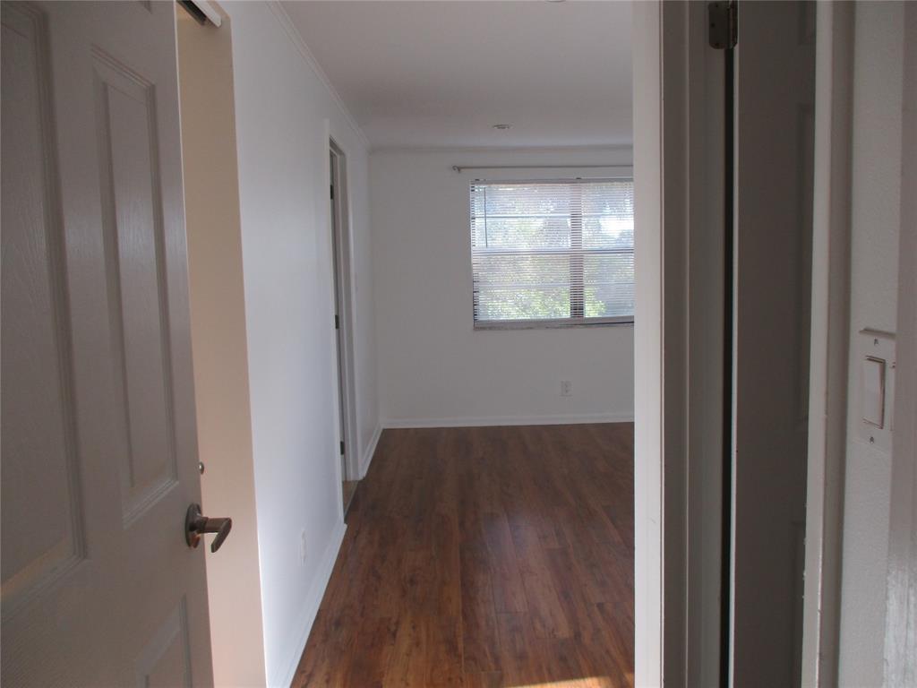 9370 Southwest 8th Street, Unit 312 312 Boca Raton, FL 33428 - Photo 27 of 41 a view of a hallway with wooden floor and closet