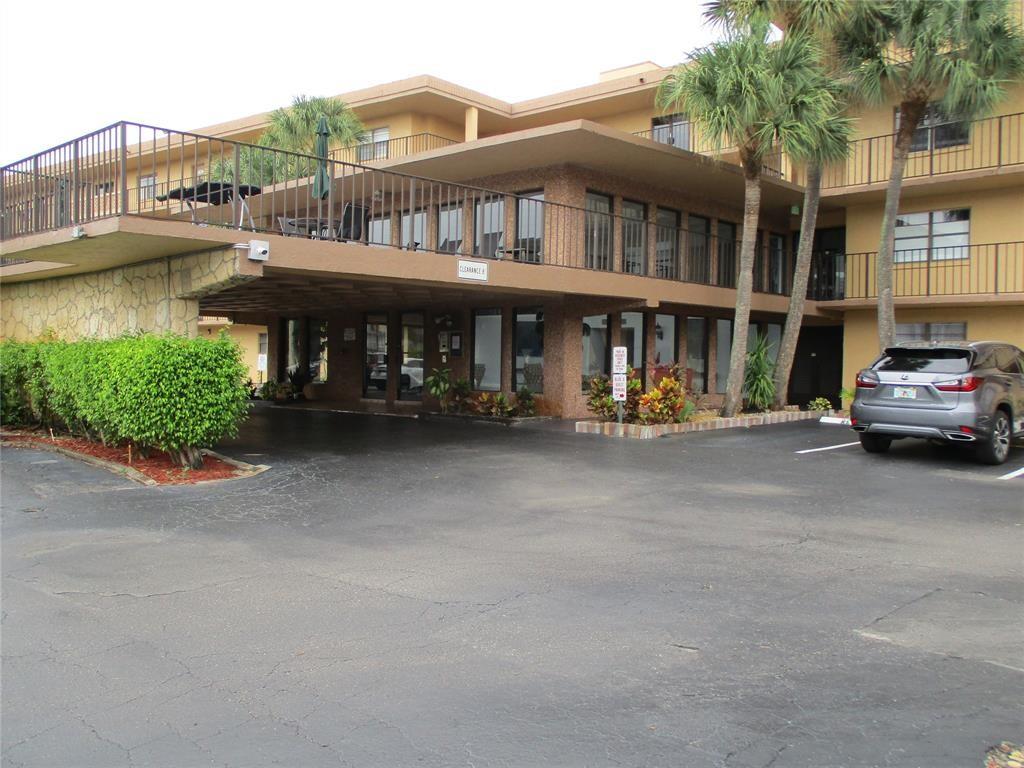 9370 Southwest 8th Street, Unit 312 312 Boca Raton, FL 33428 - Photo 3 of 41 a car parked in front of a house