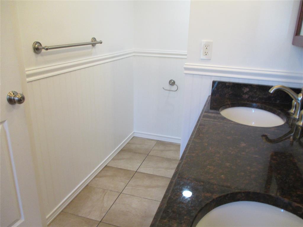 9370 Southwest 8th Street, Unit 312 312 Boca Raton, FL 33428 - Photo 33 of 41 a bathroom with a sink and mirror