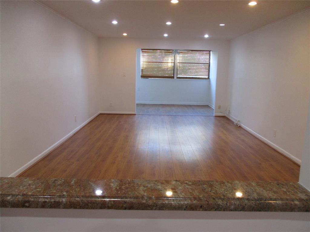 9370 Southwest 8th Street, Unit 312 312 Boca Raton, FL 33428 - Photo 38 of 41 a view of room with wooden floor