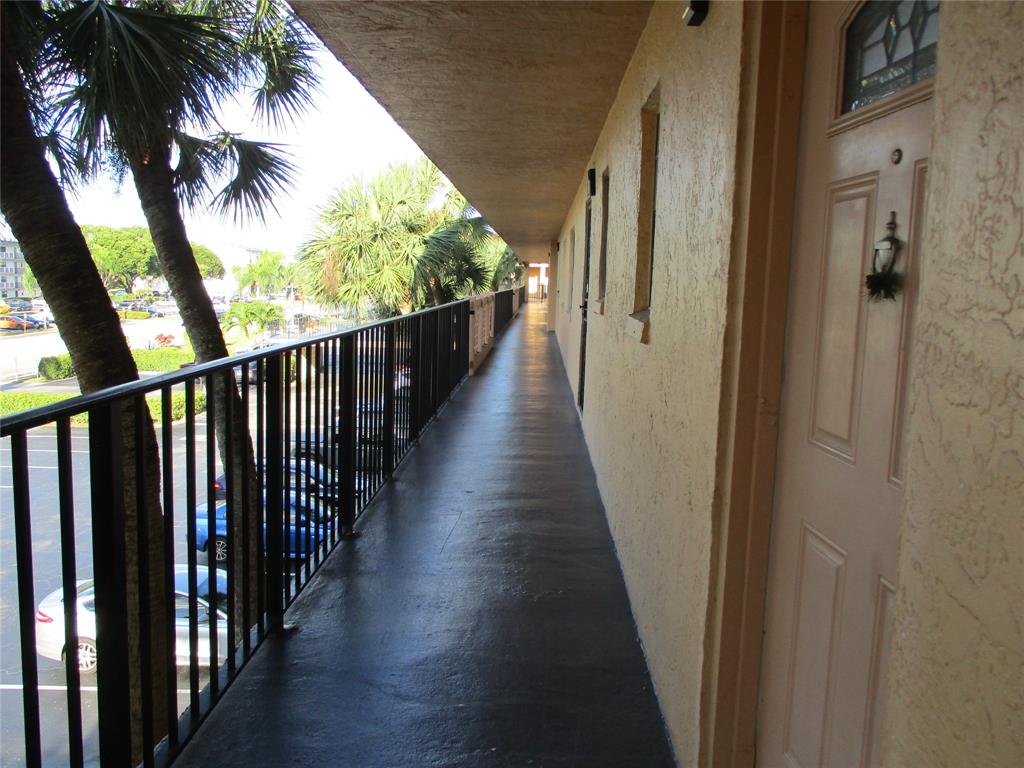9370 Southwest 8th Street, Unit 312 312 Boca Raton, FL 33428 - Photo 40 of 41 a view of balcony with wooden floor