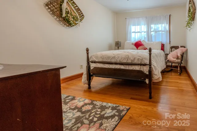 a bedroom with bed and a window