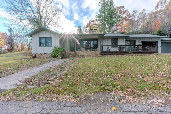 a front view of house with yard and seating area