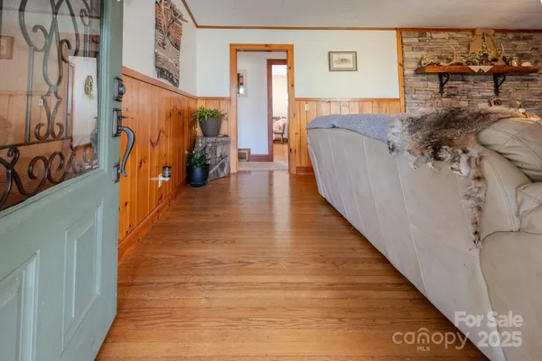 a bed room with a bed and a potted plant