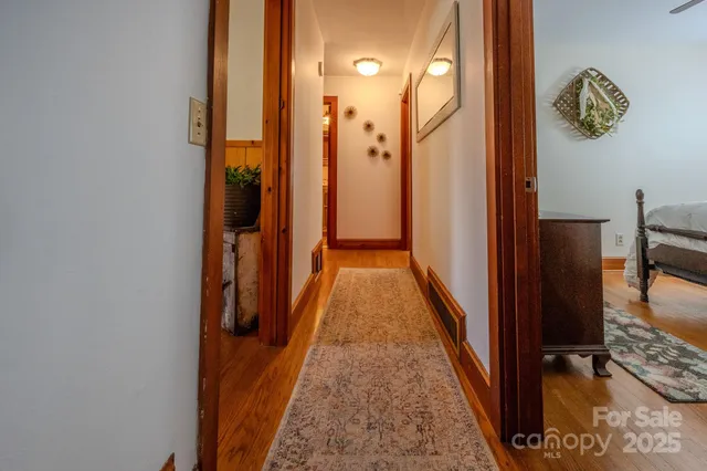a living room with a rug and a table