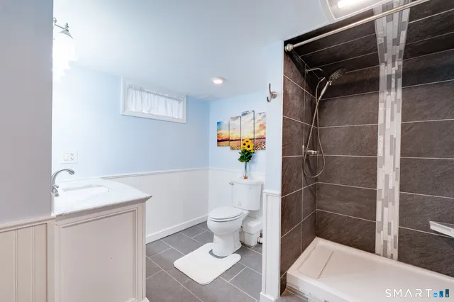 a bathroom with a sink a vanity and a mirror