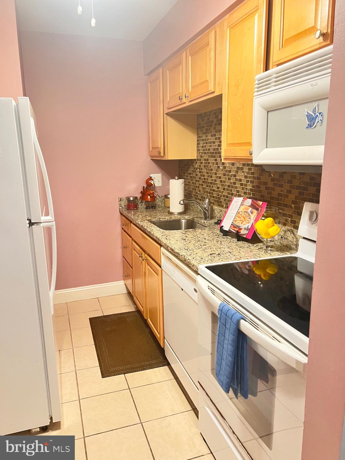 5909 Prince James Drive, Unit D Springfield, VA 22152 - Photo 6 of 18 a kitchen with stainless steel appliances a stove a sink and a refrigerator
