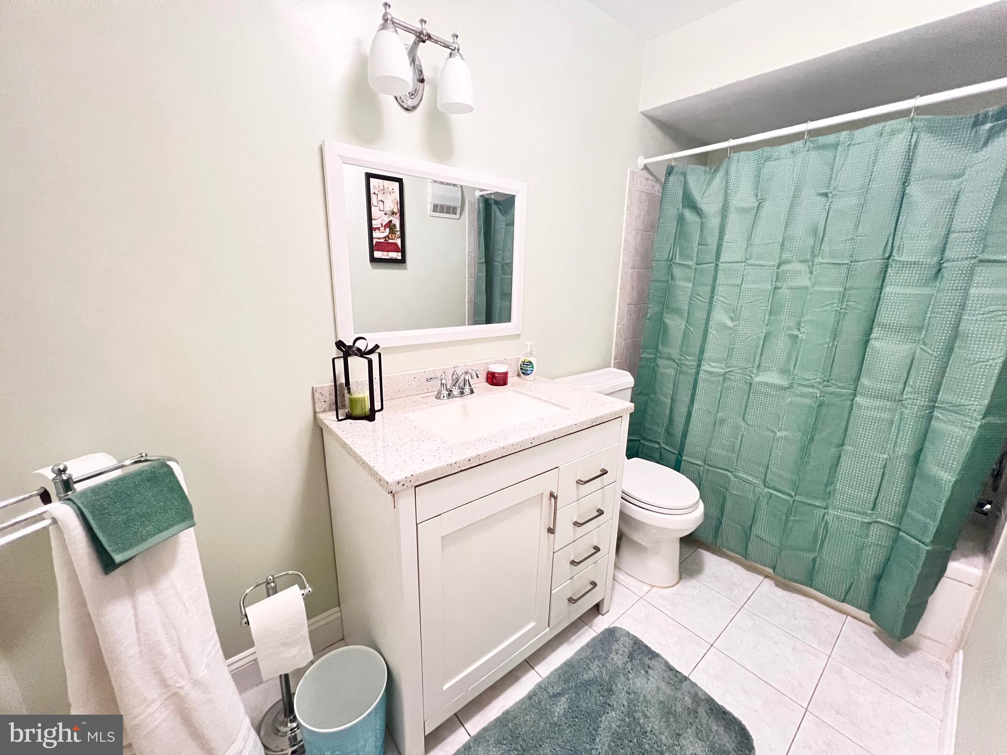 5909 Prince James Drive, Unit D Springfield, VA 22152 - Photo 9 of 18 a white toilet sitting next to a bathroom sink